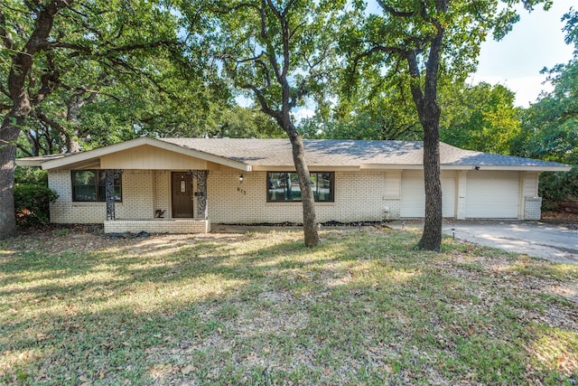 ranch-style house with a garage and a front yard