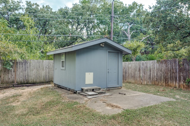 view of outbuilding with a lawn