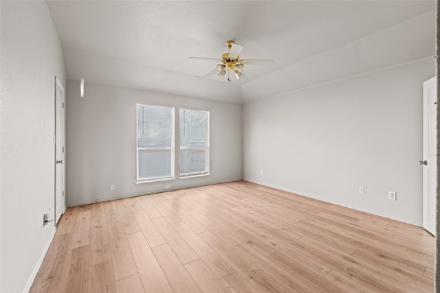 empty room with ceiling fan and light wood-type flooring