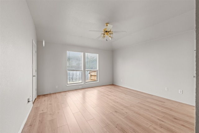 spare room featuring ceiling fan and light hardwood / wood-style flooring