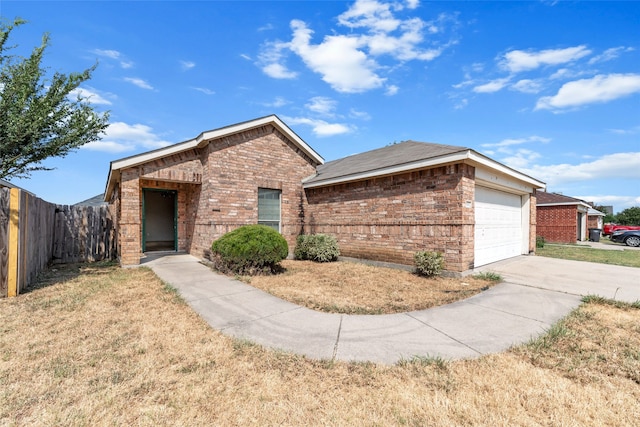 single story home featuring a garage and a front yard