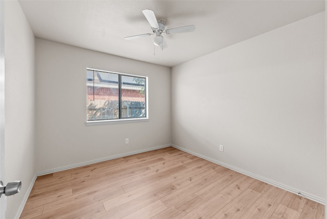 empty room with light wood-type flooring and ceiling fan