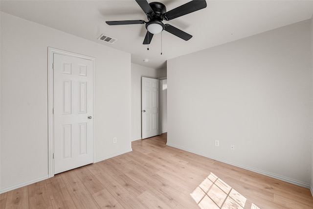 unfurnished bedroom with ceiling fan and light hardwood / wood-style floors