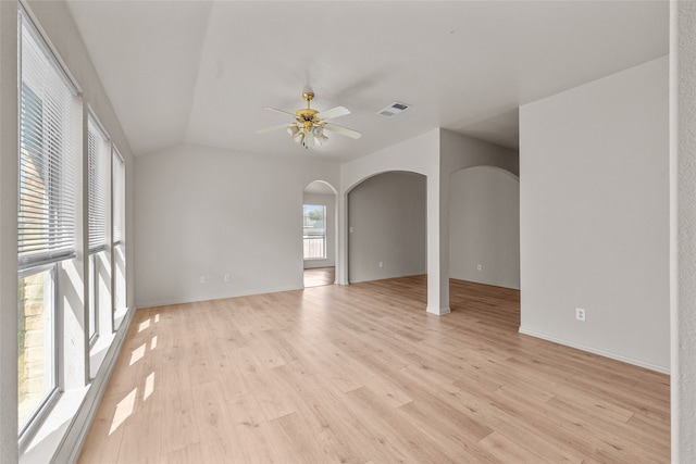 unfurnished room with lofted ceiling, light hardwood / wood-style flooring, and ceiling fan