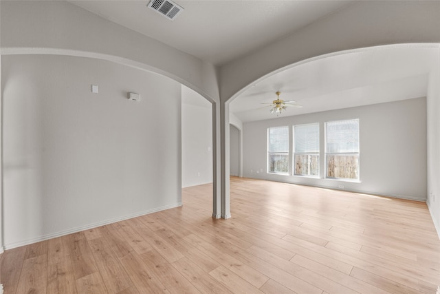 spare room with ceiling fan and light hardwood / wood-style floors