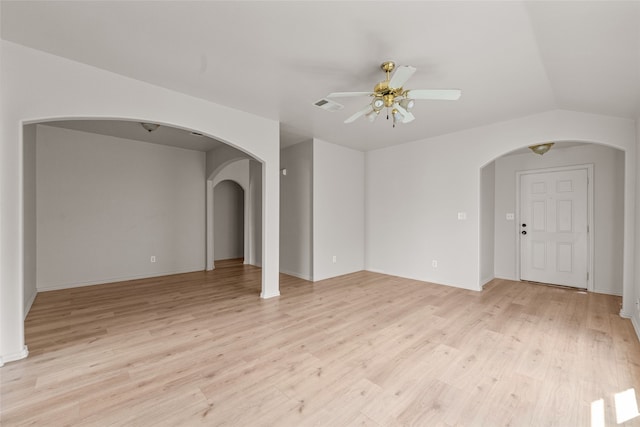 unfurnished room featuring light wood-type flooring, lofted ceiling, and ceiling fan