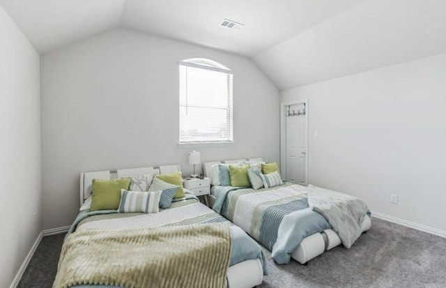 carpeted bedroom featuring vaulted ceiling