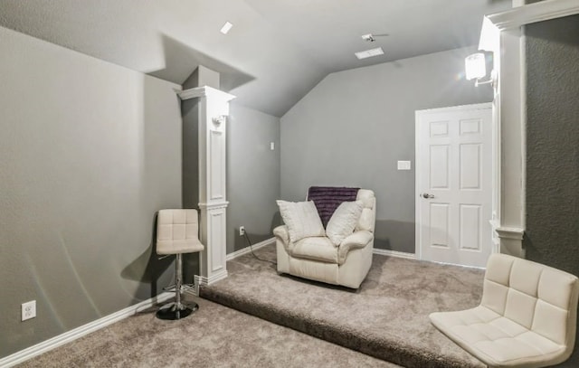 living area with carpet flooring and vaulted ceiling