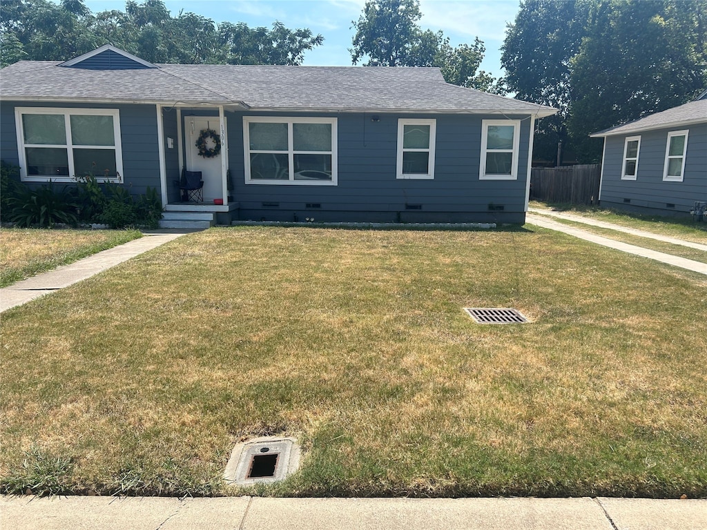 ranch-style home with a front yard