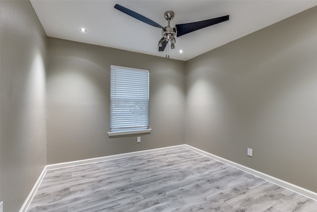 spare room featuring ceiling fan and light hardwood / wood-style floors