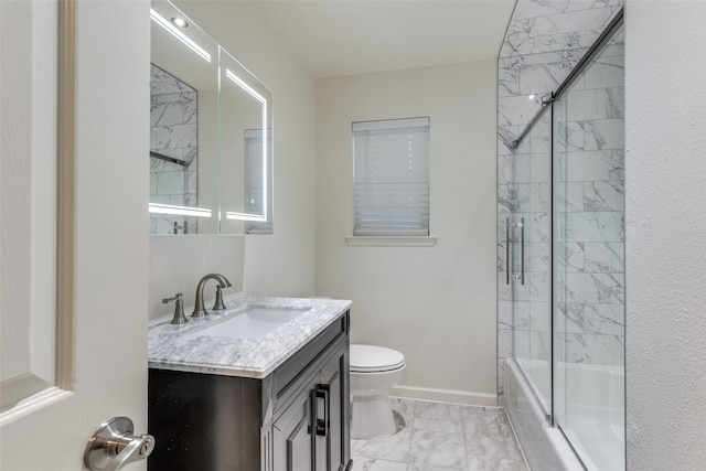 full bathroom featuring shower / bath combination with glass door, vanity, toilet, and tile patterned flooring