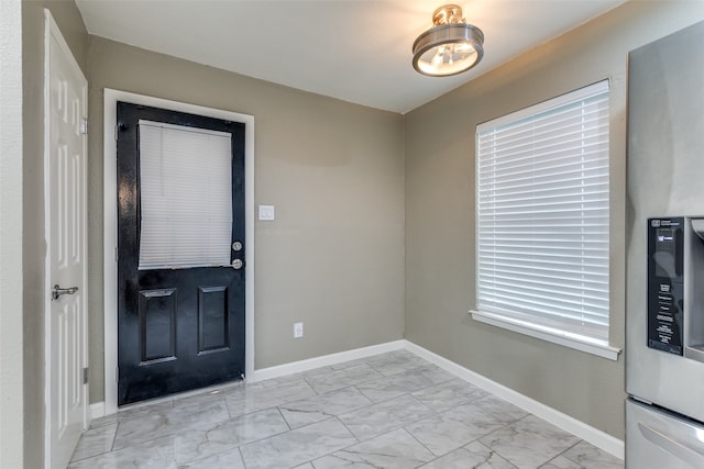 entrance foyer with light tile patterned floors