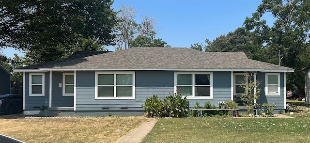 bungalow-style home featuring a front lawn