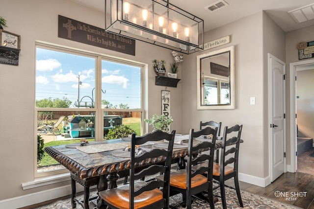 dining area featuring dark hardwood / wood-style floors