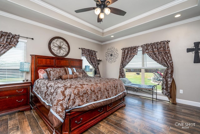 bedroom featuring multiple windows, dark hardwood / wood-style floors, ceiling fan, and ornamental molding