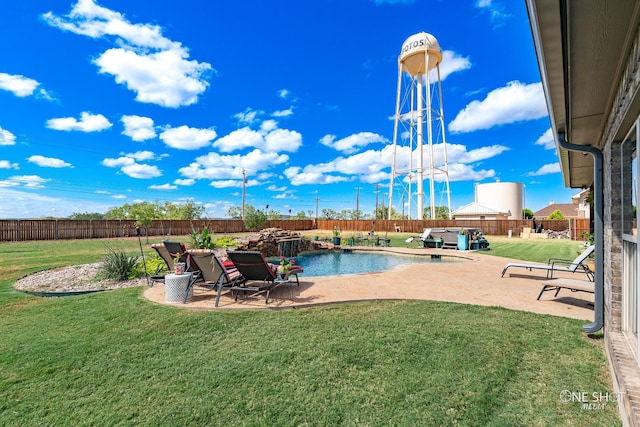 view of pool featuring a yard