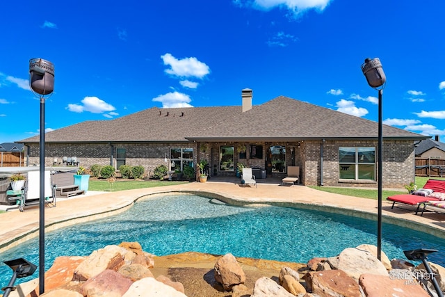 view of pool featuring a patio and a hot tub