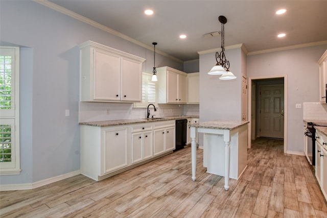 kitchen with light hardwood / wood-style flooring, stove, decorative backsplash, and decorative light fixtures