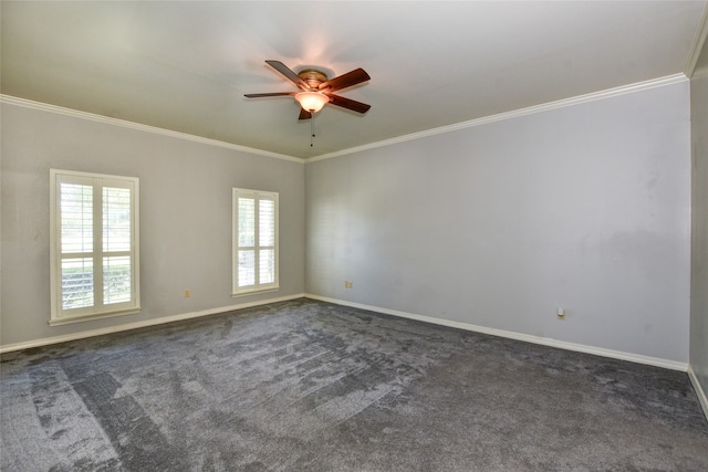 carpeted spare room with ceiling fan and ornamental molding