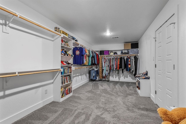 spacious closet featuring carpet and visible vents