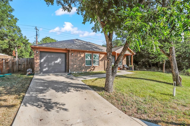 ranch-style home featuring a garage and a front yard