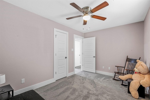 unfurnished room with light carpet, ceiling fan, and baseboards