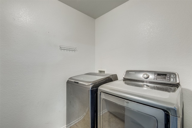 laundry area with separate washer and dryer