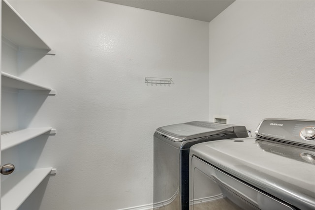 laundry room with separate washer and dryer