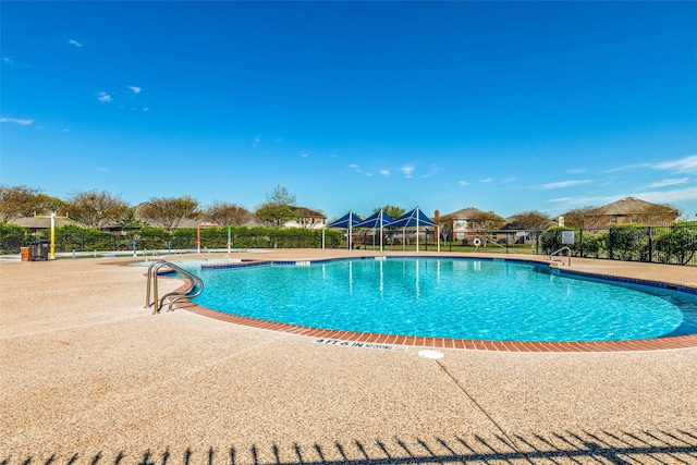 view of swimming pool with a patio