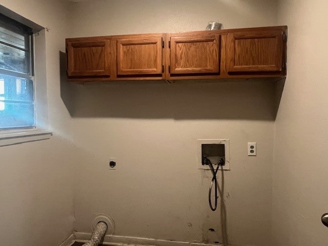 washroom featuring hookup for a washing machine, cabinets, gas dryer hookup, and electric dryer hookup