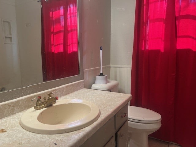 bathroom with vanity and toilet