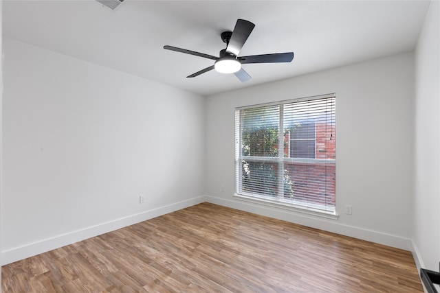 unfurnished room featuring light hardwood / wood-style flooring and ceiling fan