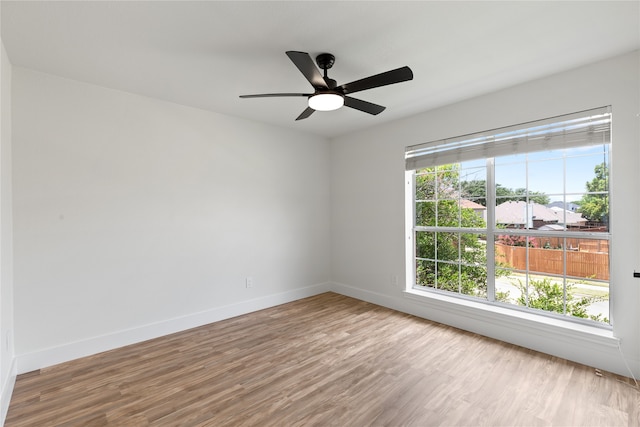 spare room with ceiling fan and light hardwood / wood-style flooring