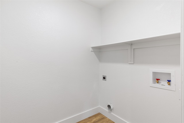 laundry area with hookup for a washing machine, hardwood / wood-style flooring, and electric dryer hookup