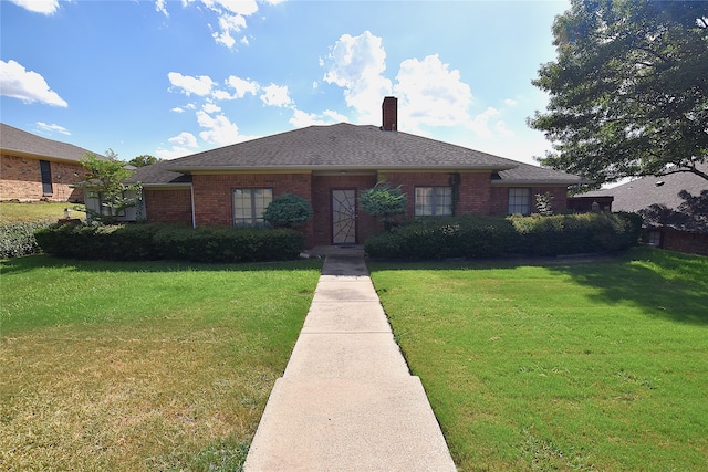 ranch-style house featuring a front lawn