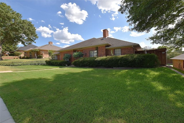 single story home with a front yard