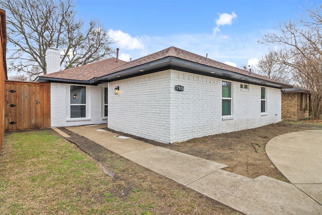 rear view of house with a yard