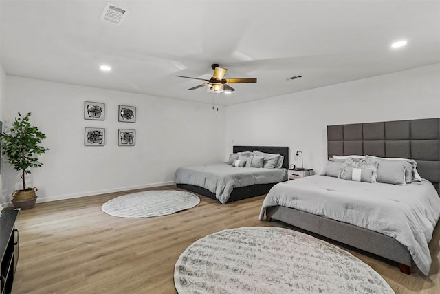 bedroom with ceiling fan and light wood-type flooring