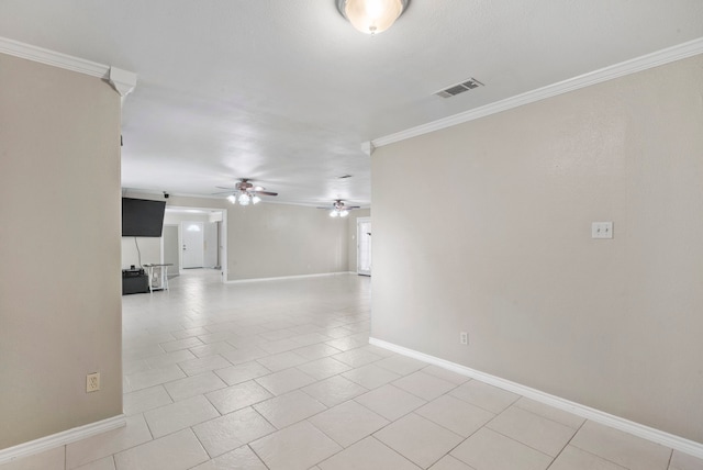 empty room with ornamental molding, light tile patterned flooring, and ceiling fan