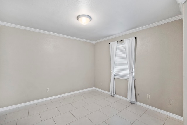 empty room featuring ornamental molding and light tile patterned flooring