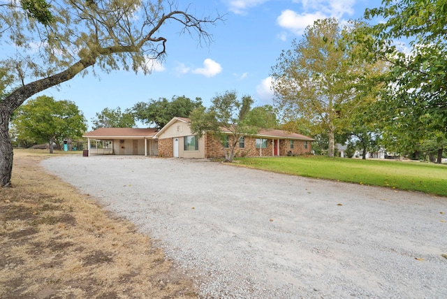 single story home featuring a front yard