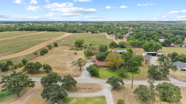 birds eye view of property with a rural view