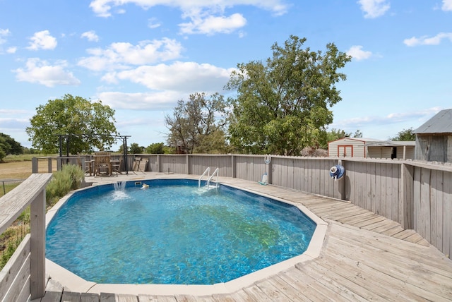 view of swimming pool featuring a deck