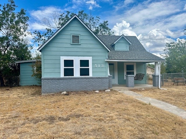 bungalow-style house featuring a front yard