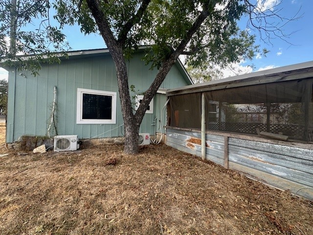 back of property featuring ac unit