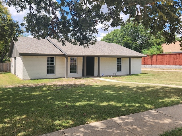 ranch-style home with a front lawn