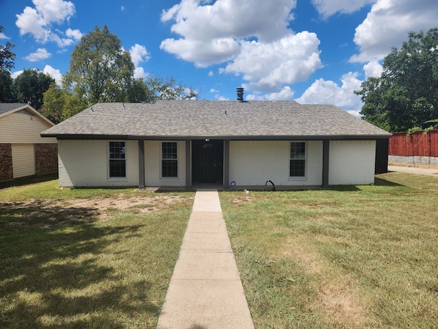 ranch-style home with a front lawn