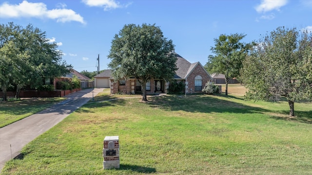 obstructed view of property featuring a front yard