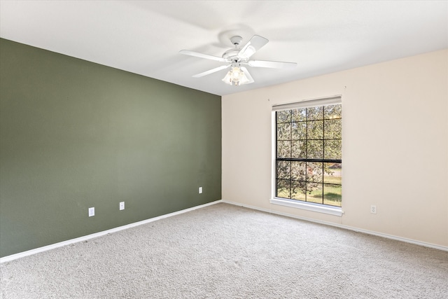 carpeted empty room with ceiling fan