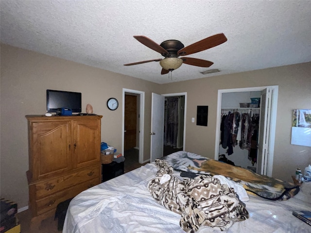 bedroom featuring a textured ceiling, a closet, and ceiling fan